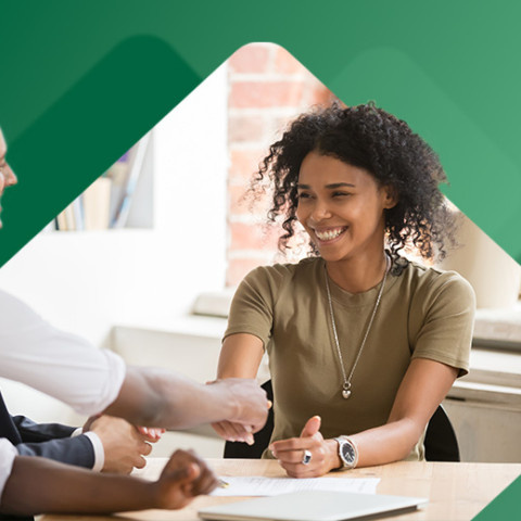 Employee shaking hand with hiring team