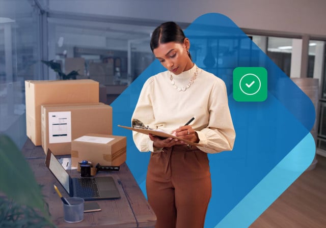 A business owner preparing to ship out some boxes