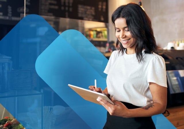 Waitress using tablet in restaurant