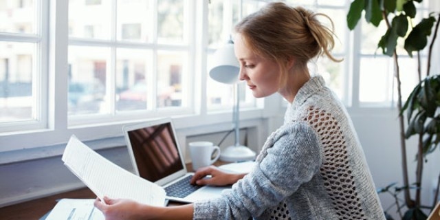 A business owner looking at a new employee's background check