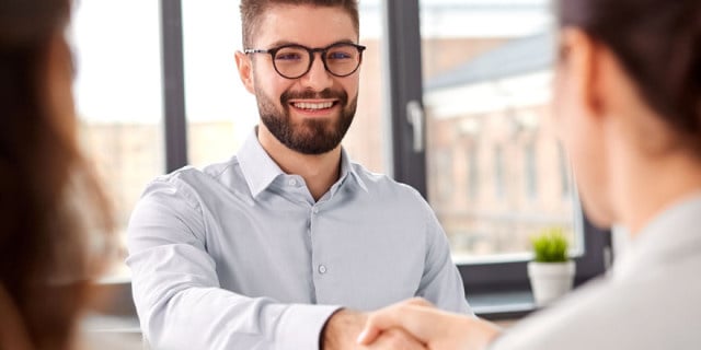 A job candidate shaking hands 