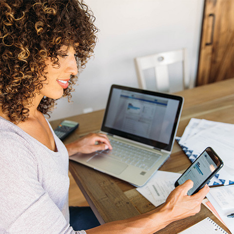 woman using using Flock on her computer and mobile device
