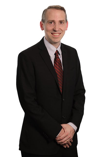 a headshot of brad schaufenbuel