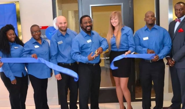 Paul Bolden, center, celebrates the opening of Bolden Insurance Agency in Dallas, Texas.