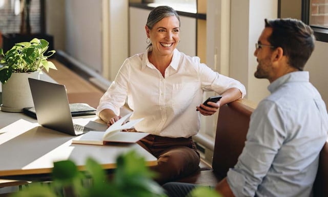 two hr professionals discussing peo services