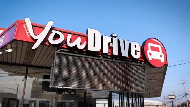 You Drive Auto dealership with large logo