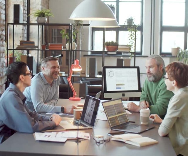 A busy office with employee working together
