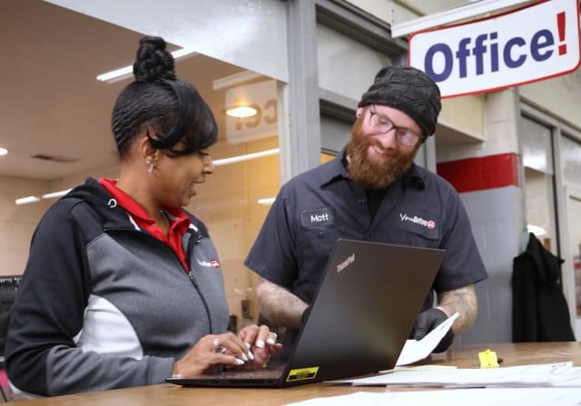 man and woman work at office counter