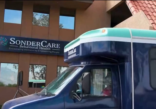 shuttle bus passes SonderCare Behavioral Health building