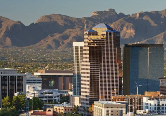 skyline view of city against mountainous desert horizon
