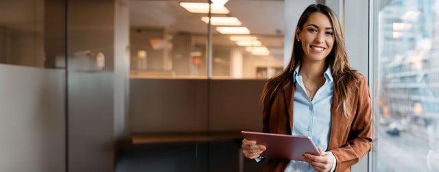 A business owner looking at her tablet