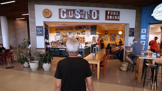 Gusto owner Patrick Giuliano opens his restaurant at the airport in Rochester, NY.