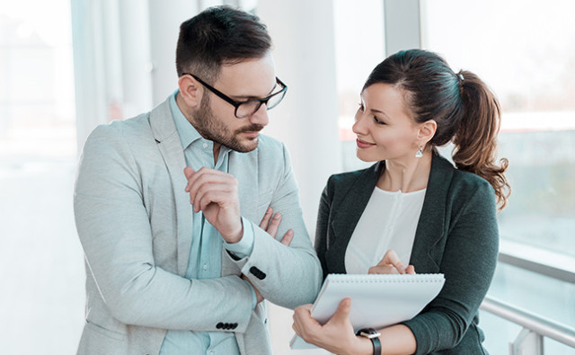 Two financial advisors talking