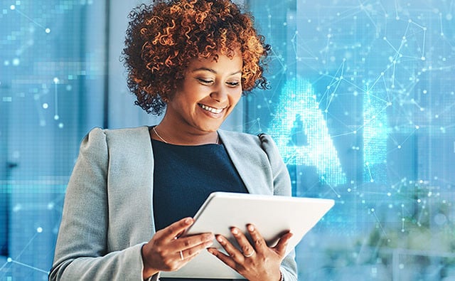Women with curly hair, wearing a blazer, looks at tablet against blue background with abstract digital effects