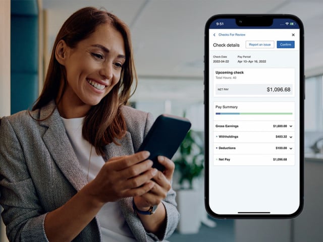 An employee checking her pay details to make sure they're accurate