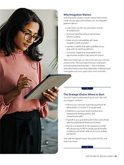 A women wearing glasses is looking at her tablet reading about why integration matters