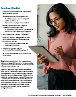 Lady holding a tablet looking over the checklist 