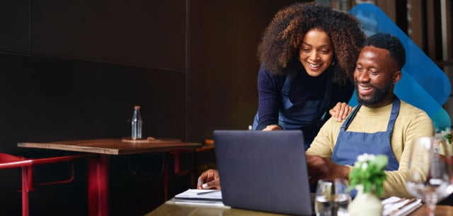 Business owners using Paychex Flex to run payroll and HR