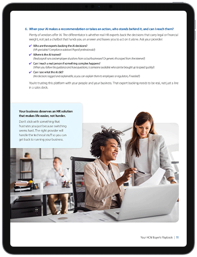 Page featuring additional questions to evaluate HCM providers, guidance on AI accountability and support resources, and an image of professionals collaborating at a desk in a modern office environment.