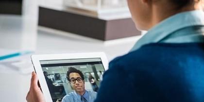 Women having a video conference with a co-worker (Virtual Workplace)