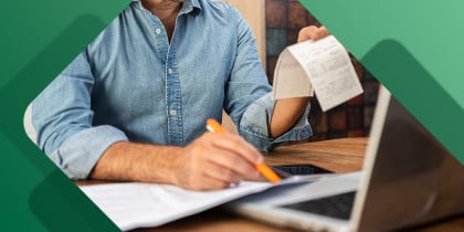 Small business owner calculating expenses