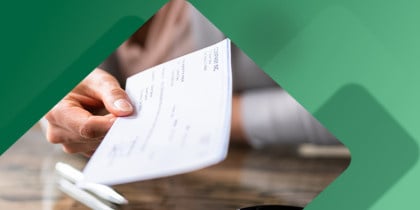 Small business owner handing over a check