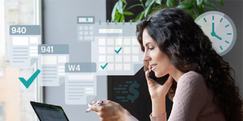 A person sits at a desk using a laptop and phone, with overlaid icons showing payroll-related documents, checkmarks, a calculator, and a clock.